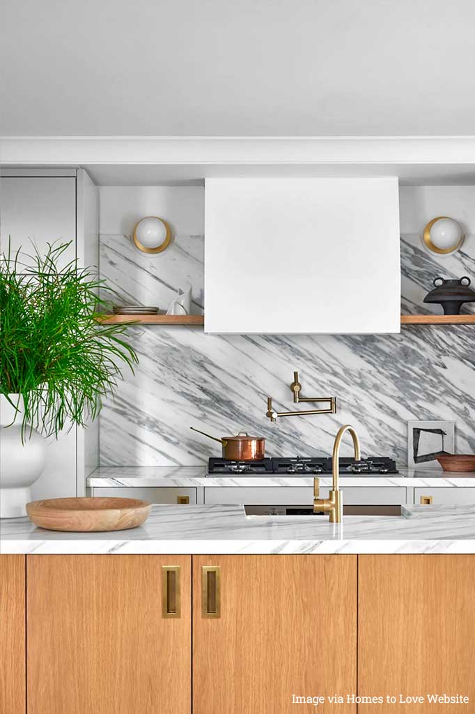 two wall lights in gold finish in the kitchen.