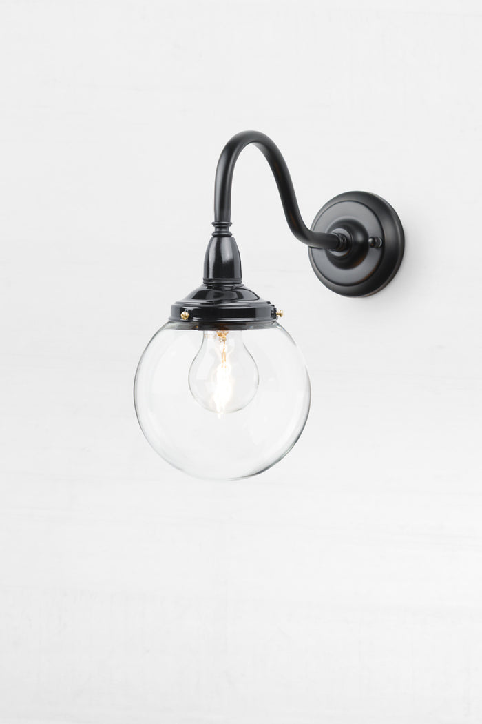 Small black gooseneck outdoor wall light with a bakelite gallery and small clear glass ball shade.