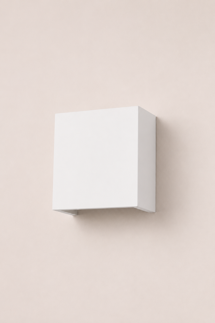 Front view of the Griffs Plaster Wall Sconce with the light switched off, highlighting the clean square silhouette and smooth plaster finish.