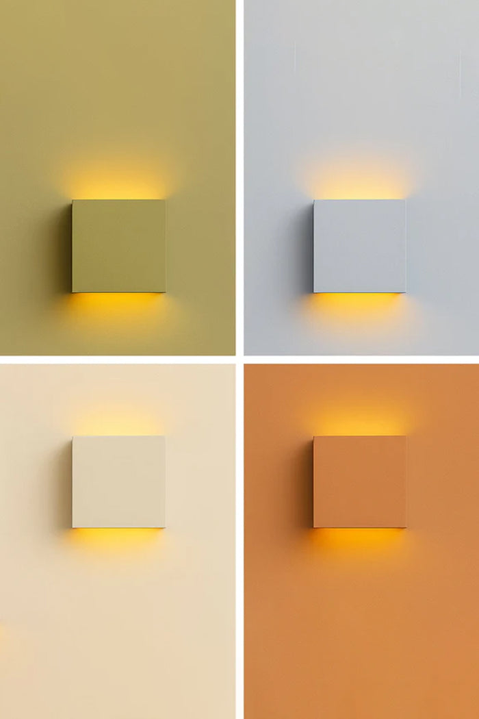 Griffs Plaster Wall Sconce shown illuminated and unlit in four lifestyle colour settings, featuring a paintable white gypsum square wall light with up and down illumination.