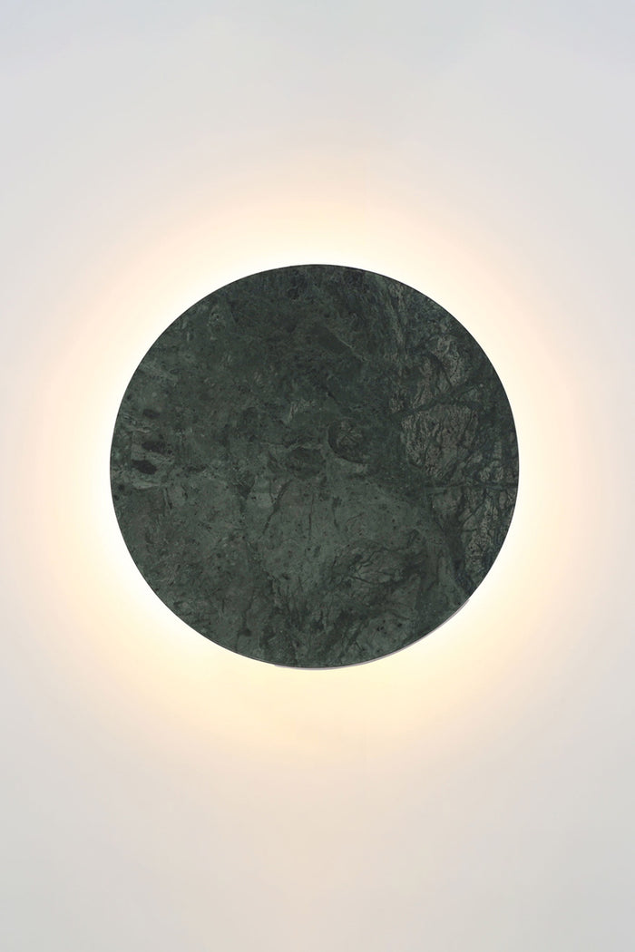 Small green marble circular back-lit LED wall light.