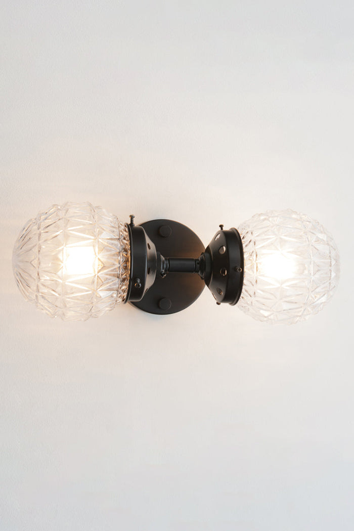 features two glass shade characterised by diamond cut points textured pattern on them.