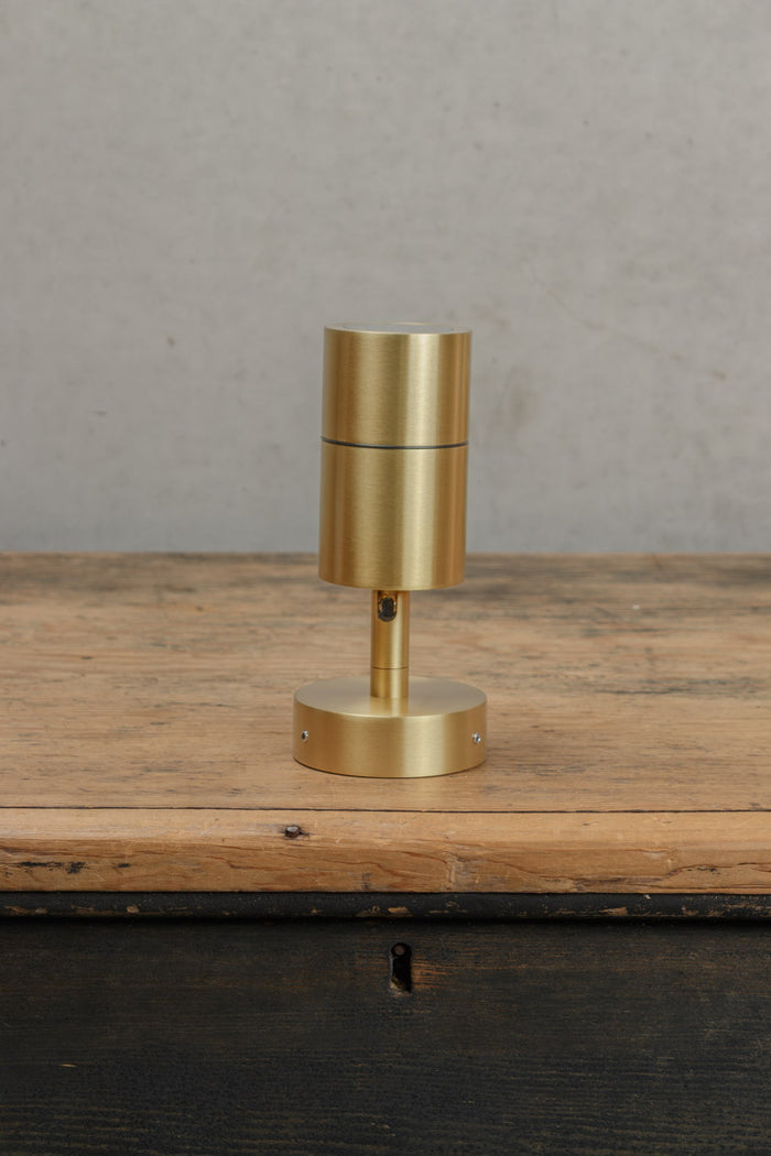 Uninstalled fully extendedn outdoor brass spotllight.