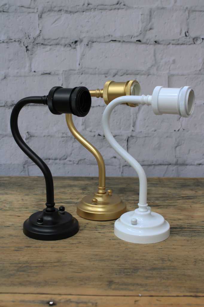Gold, white, and black finishes of gooseneck arm.