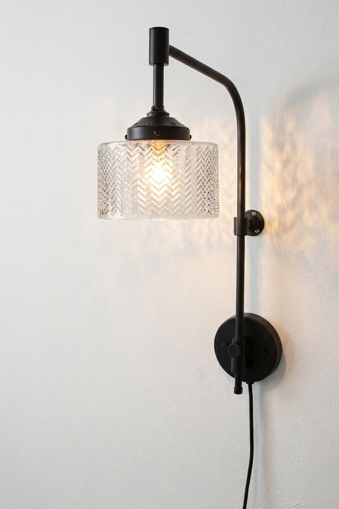 Black Wing Arm Wall light with inline switch paired with the Malibu clear glass shade.