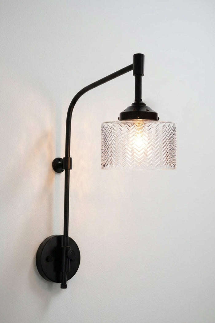 Malibu Glass Wing Arm Wall Lamp on a white wall.