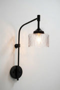 Malibu Glass Wing Arm Wall Lamp on a white wall.