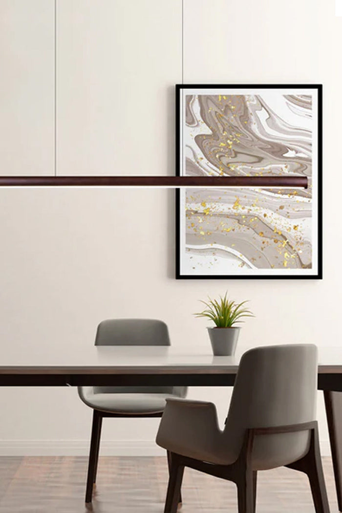 Walnut finished large linger pendant light in a dining space.