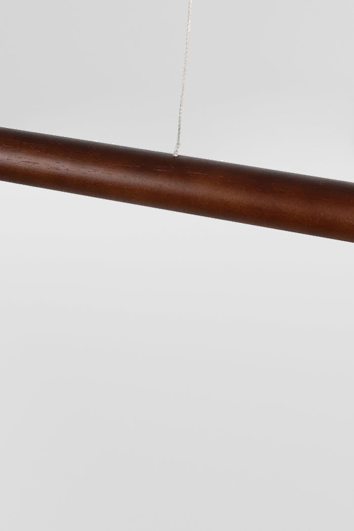 Close up of the cable and finish of the walnut finished pendant light.