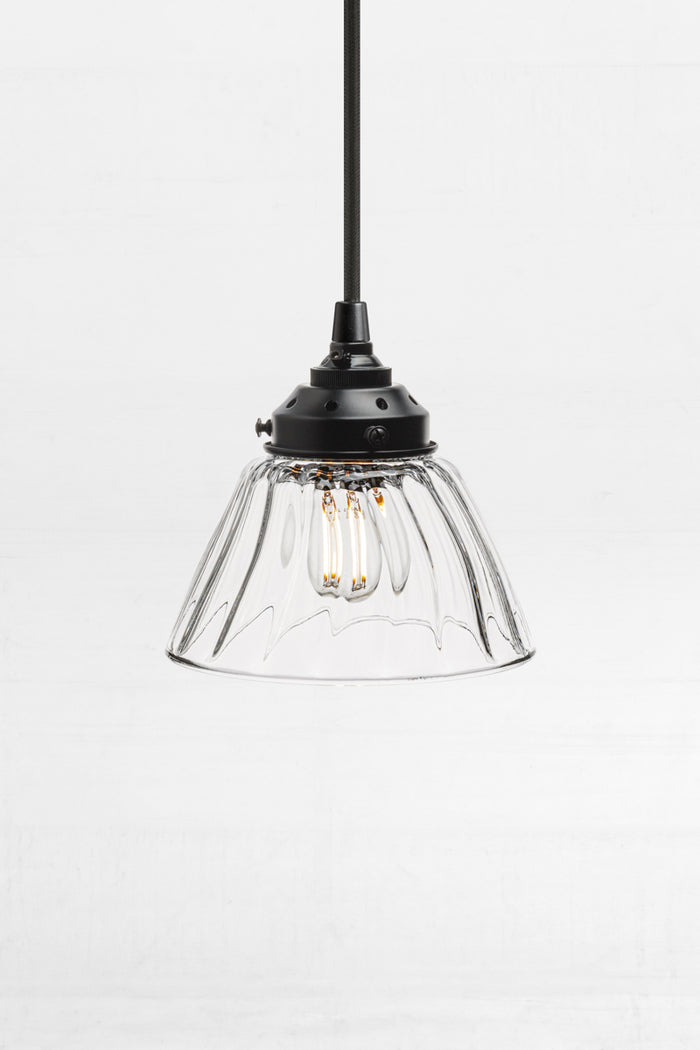 clear glass shade with a wide opening