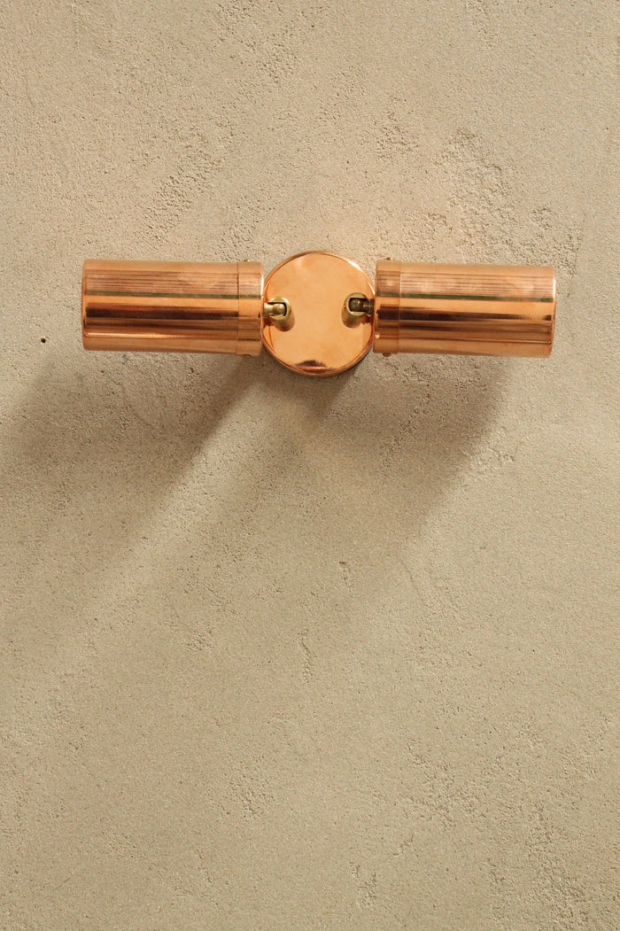 Multi directional outdoor spotlight.  . polished copper lighting