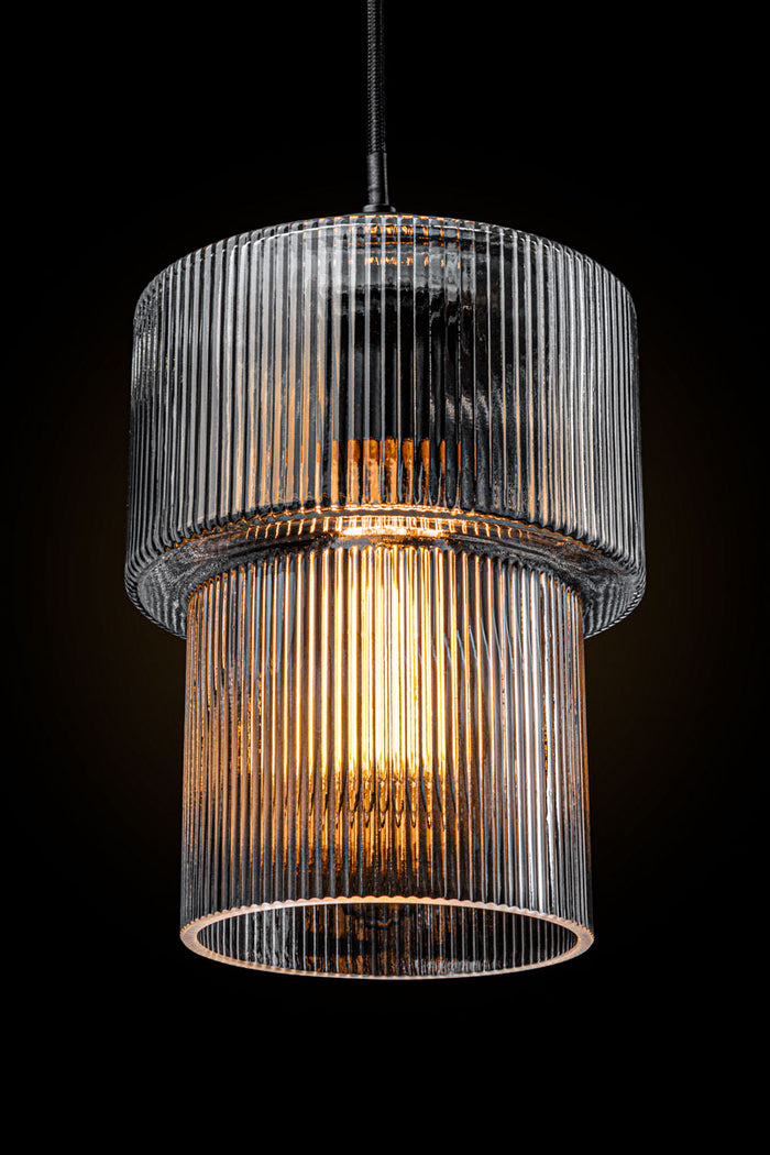 Clear reeded shade in a dark room to showcase shade detailing.