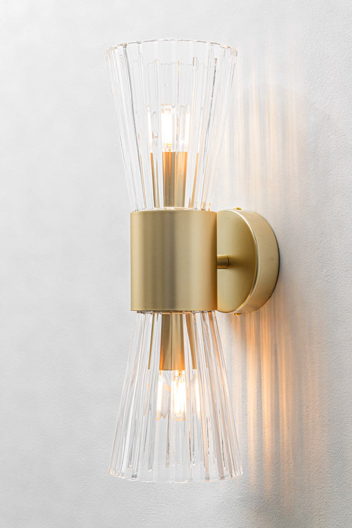 Hourglass silhouette with two open-ended fluted glass cones facing up and down with black fitting finish