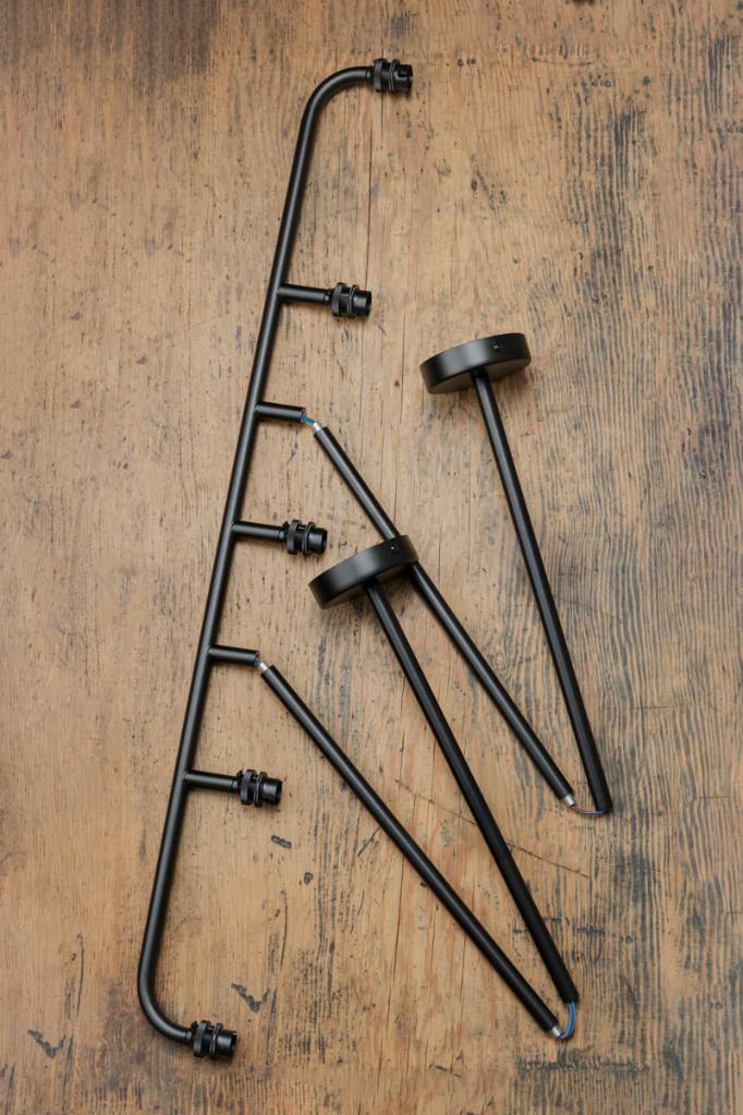 Deconstructed Five lamp linear chandelier in black.