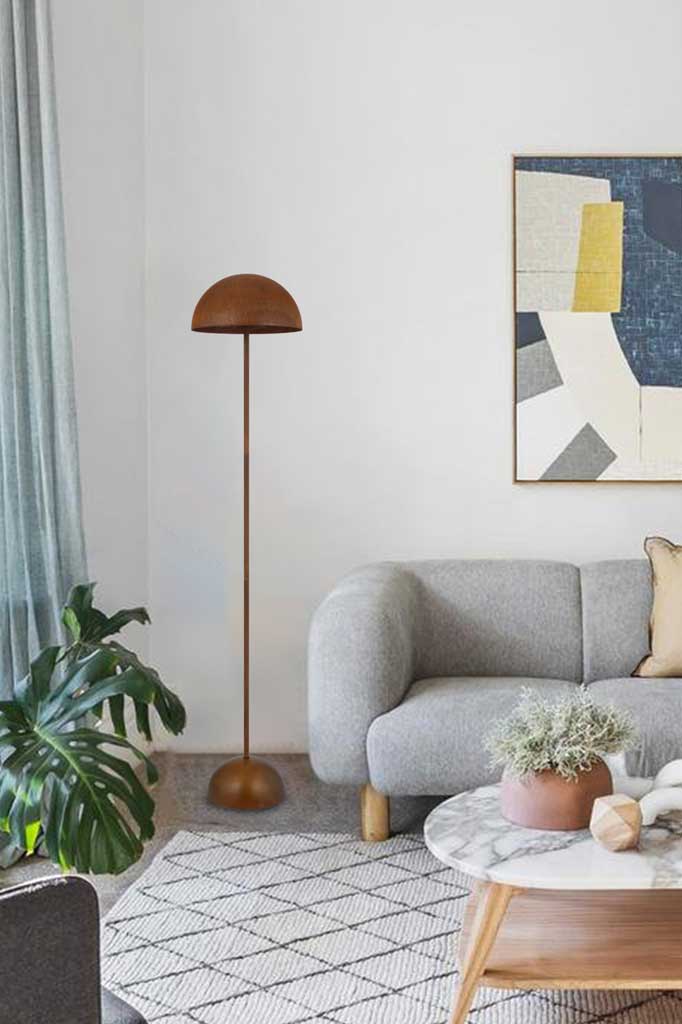 Newman Floor Lamp in rust situated in a lounge room.