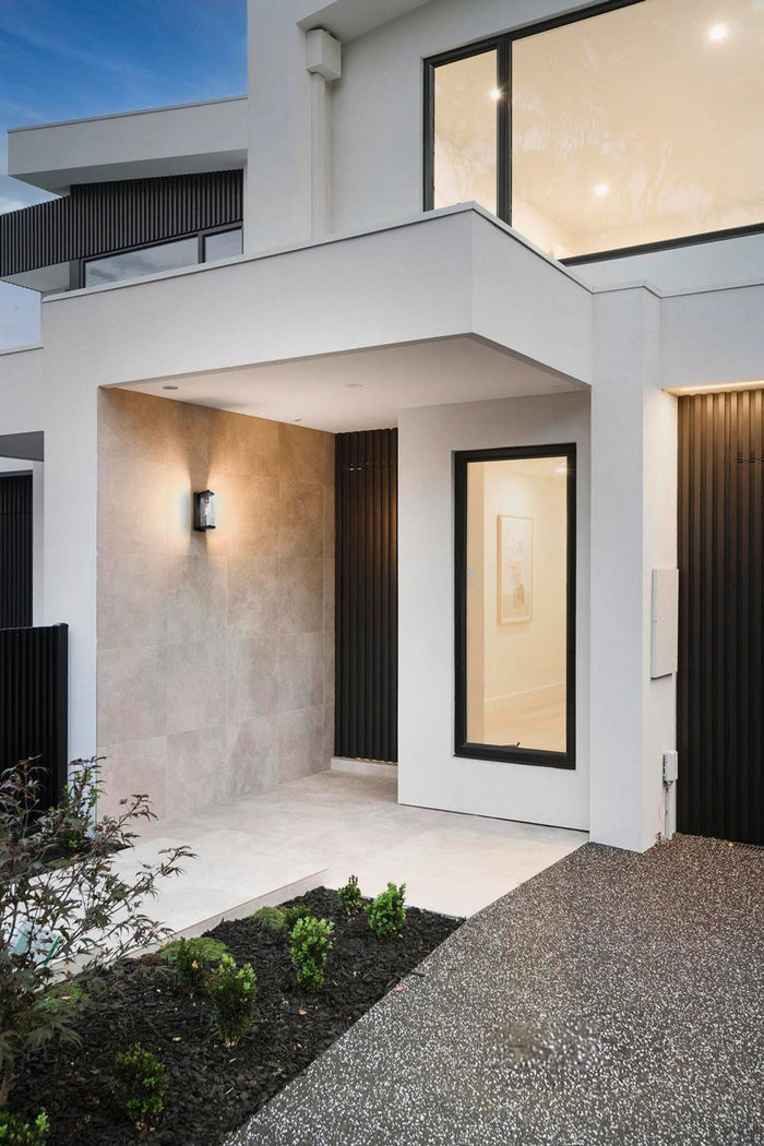 Inclosed porch light at the front door of a new modern build.
