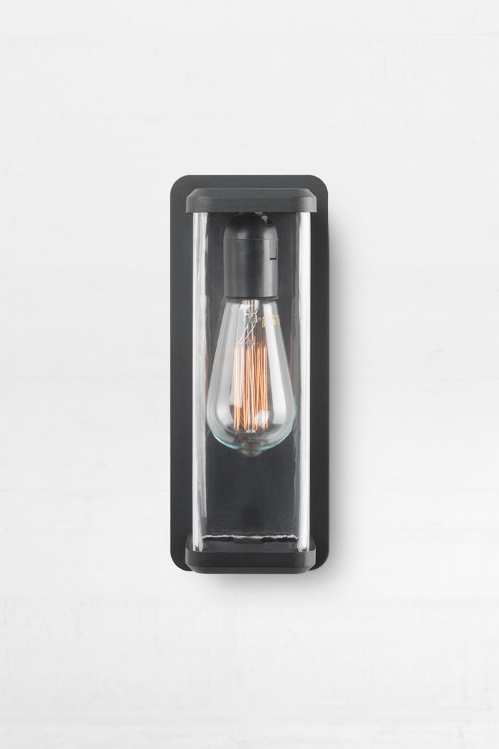 Made from steel in a black finish with rectangular prism glass housing design.