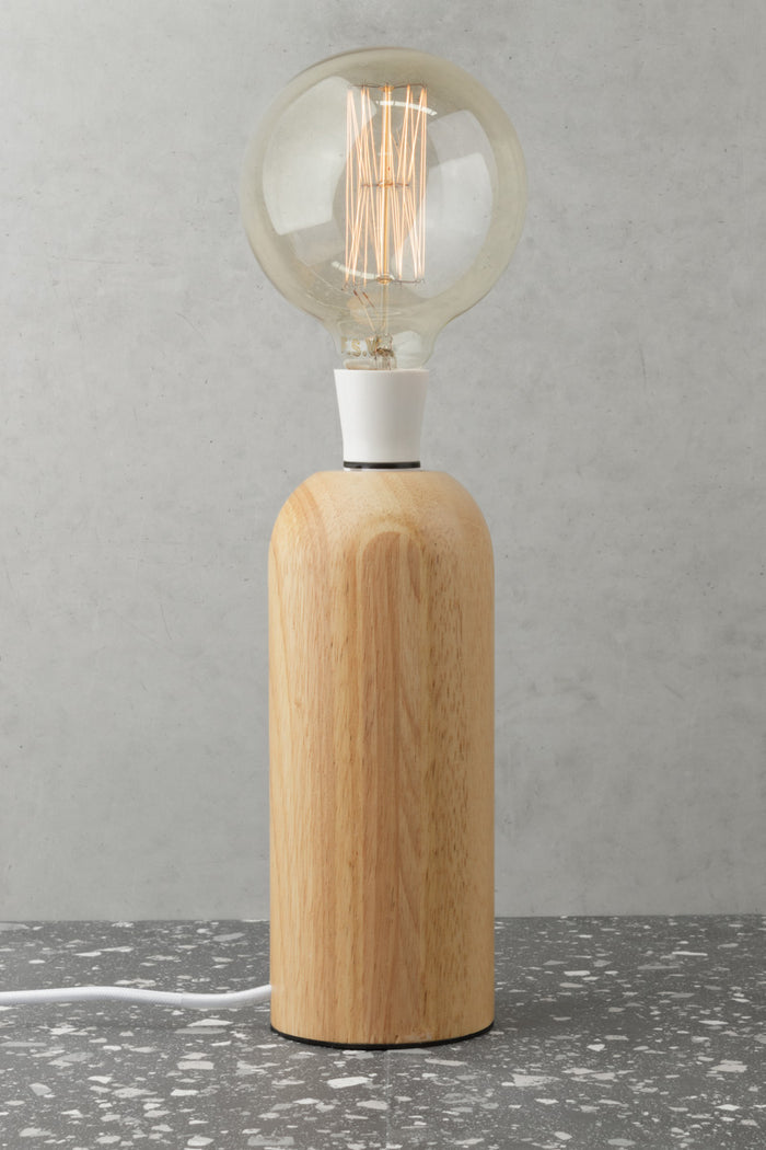 Simple scandinavian wood block table lamp, paired with a round bulb.