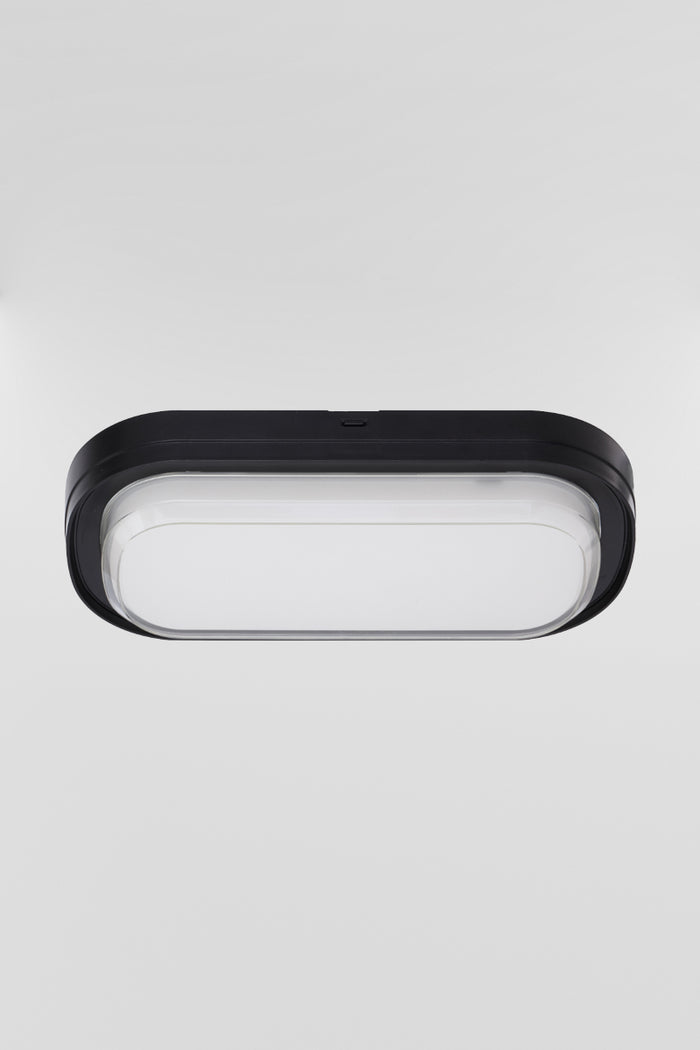 Top view of the black framed polycarbonate rectanguler bunker light, with the LED light source turned off.