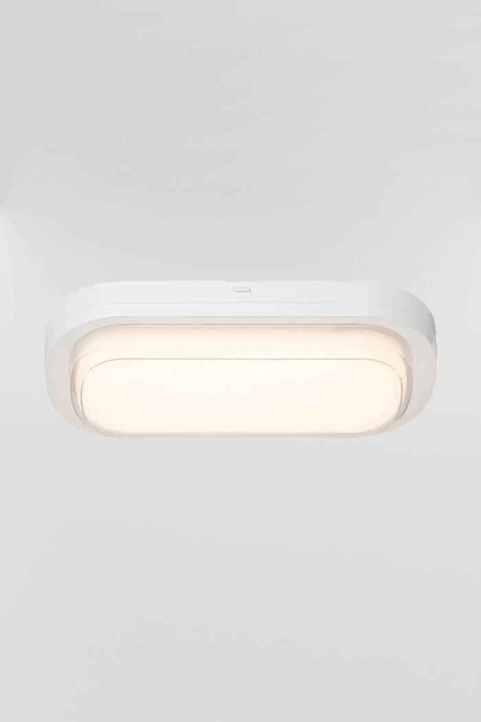 Top view of the white framed polycarbonate rectanguler bunker light, with the LED light source turned on.