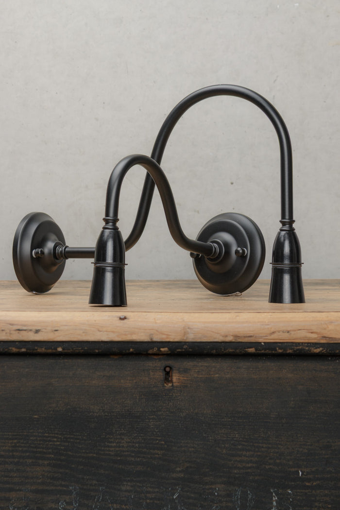 Small and large B22 gooseneck outdoor wall sonces in black.
