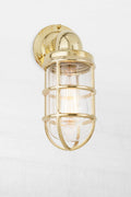 Side view of the solid brass marine style caged wall light.