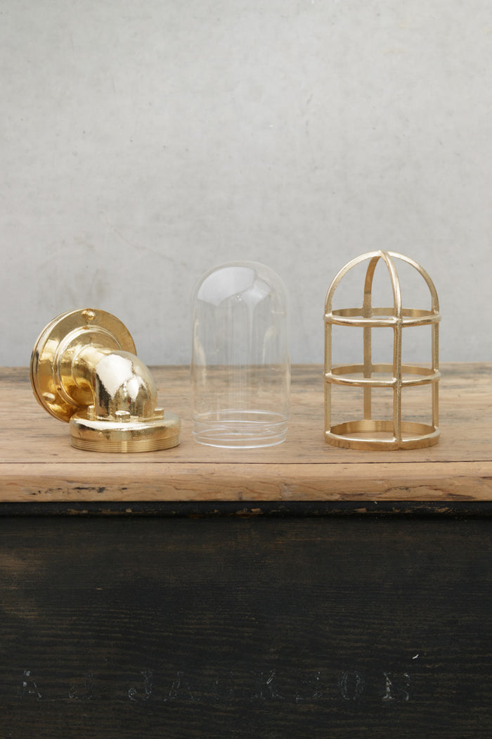 Photo of components of the brass wall light.