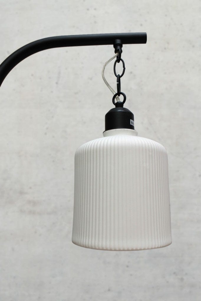 Close-up of pleat detailing on ceramic shade.