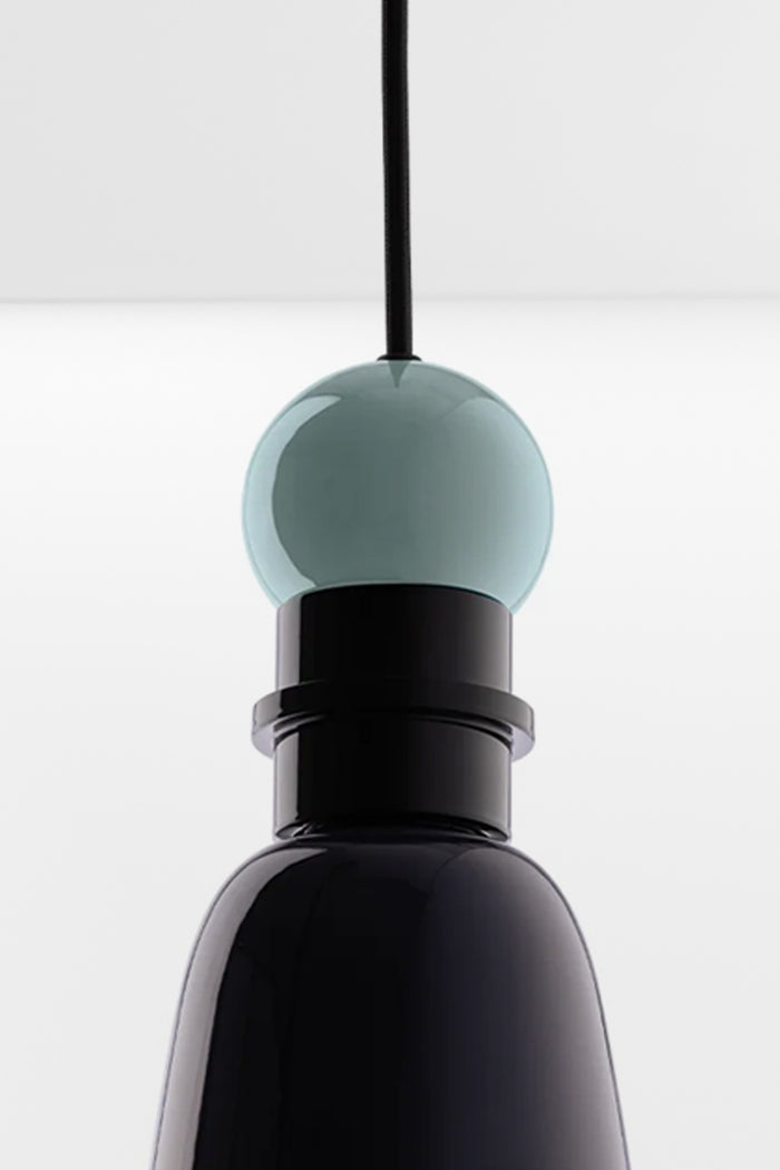Close up detail of the Putnam Pendant Light Style B featuring mist blue sphere detail and glossy navy blue aluminium shade