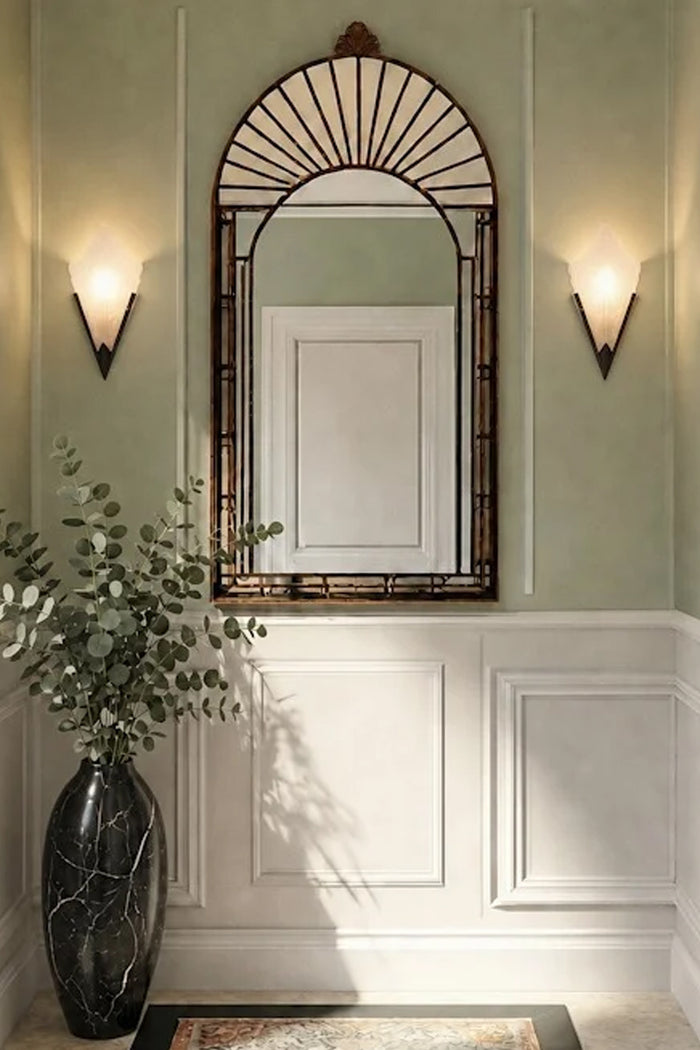 A pair of Ritz Deco Glass Wall Lights lit up and affixed on either sides of a mirror.
