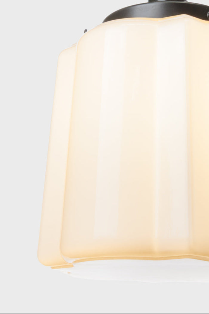 Close up of the opal curved glass shade with distinctive deco scalloped detailing.