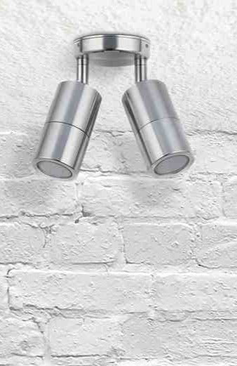 Twinlight spotlight in titanium affixed on a brick wall.