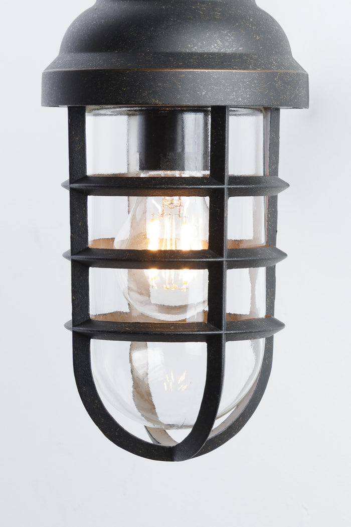 Close up of the Antique Bronze finished steel shade with cage feature and clear inner glass shade.