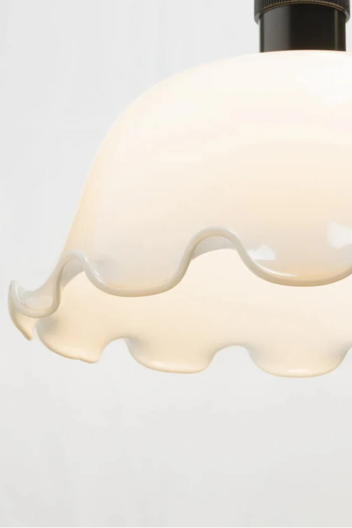 Opal glass and featuring a scalloped edging