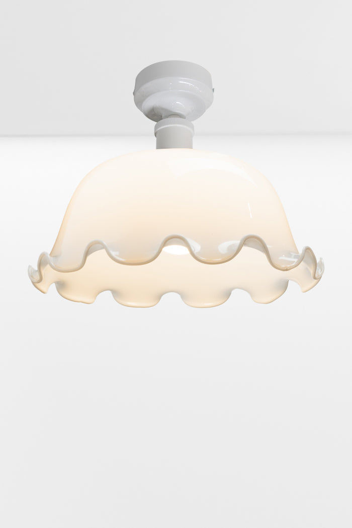 White batten older paired with an opal dome shade with frilled edging.
