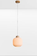 Small curved, opal glass shade with ripple effect and timber detailing, light on.