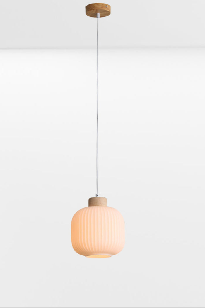 Small curved, opal glass shade with ripple effect and timber detailing, light on.