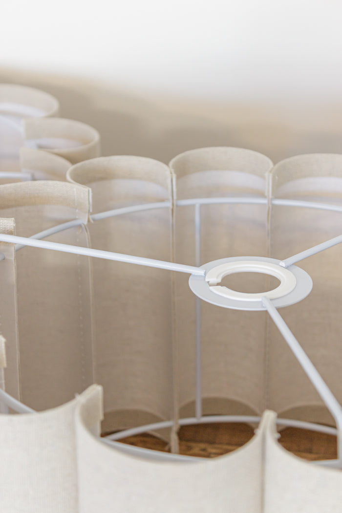 rounded cylindrical fabric panels extending from a white metal frame