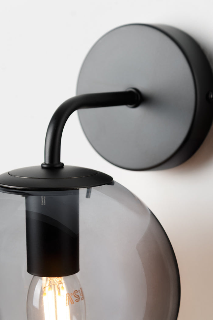 black metalware on wall sconce