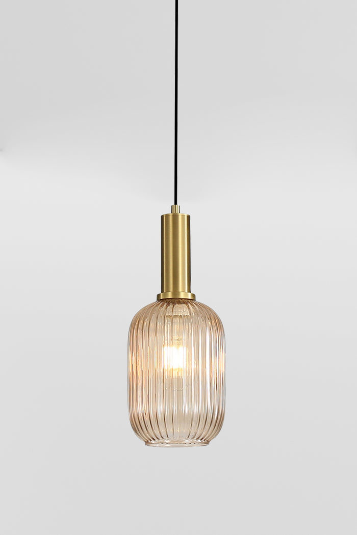 Close up of the Amber reeded glass shade with antique brass metalware.