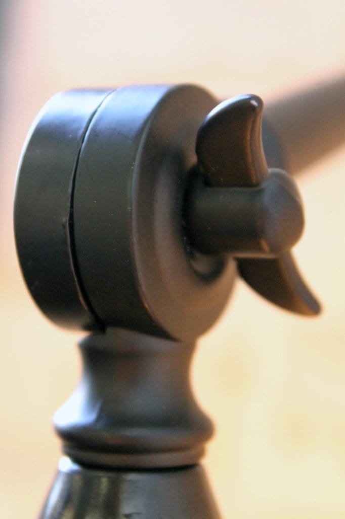 Two arm swing wall lamp does not require tools to lock into place.