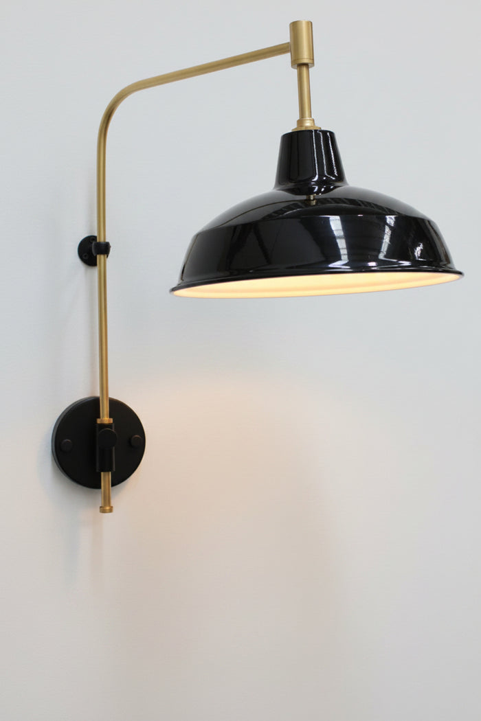 black small warehouse shade with gold arm sconce