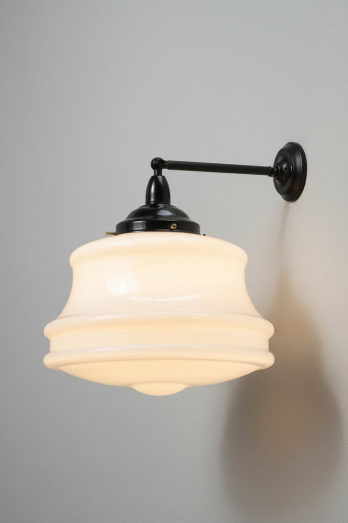 Large opal glass schoolhouse style shade on a black steel straight arm.
